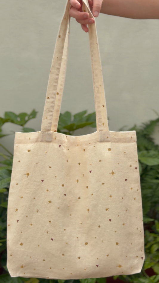 Pretty cream linen tote bag with stars and hearts scattered